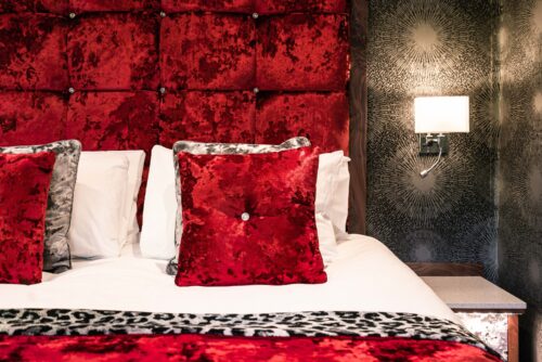 The-Cranleigh-Boutique-Hideout-House-Self-Catering-in-Bowness-on-Windermere red room and velvet pillows