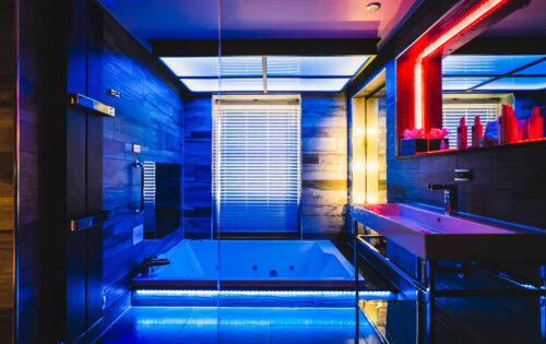 The Utopia Suite spa bathroom boasts a sunken bath and mood lighting for a next-generation spa experience