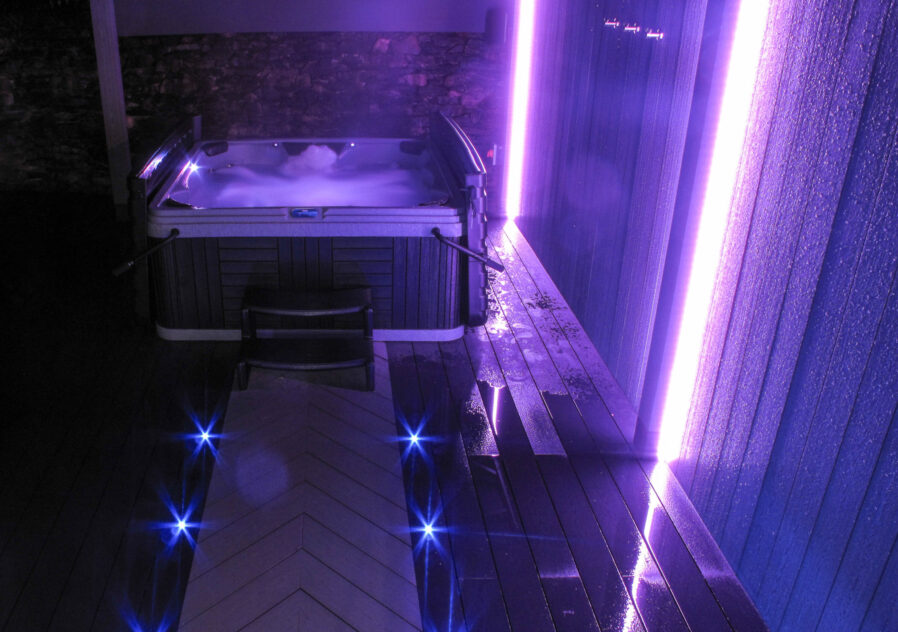 boutique self catering out door tub tub with purple mood lighting