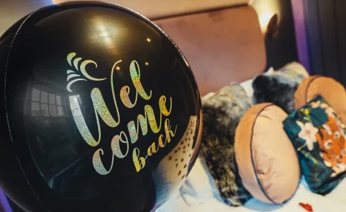 Boutique Hotel Deals - welcome back package which includes a black balloon with come back text
