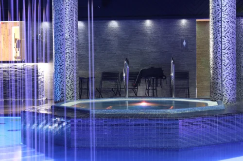 spa hotels lake district, a medium sized hot tub with mood lighting and steps
